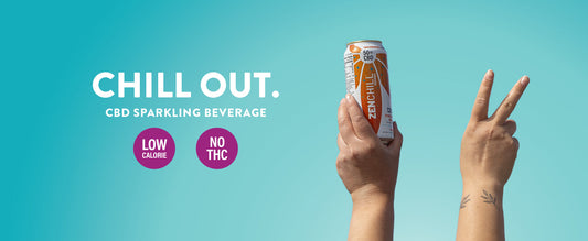 A hand holding a Zentopia Mango Chill CBD Sparkling Water and another hand holding up a peace sign