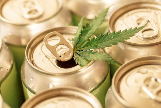 Cans of CBD Drinks with a hemp leaf