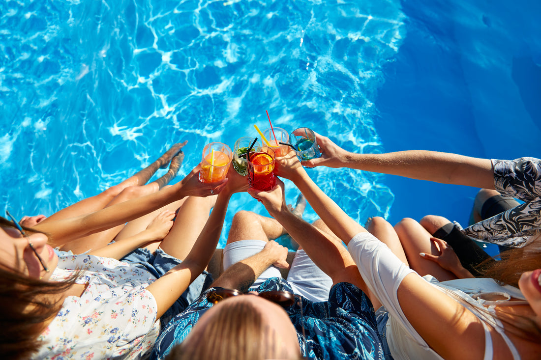 People toasting to a fun day at the pool