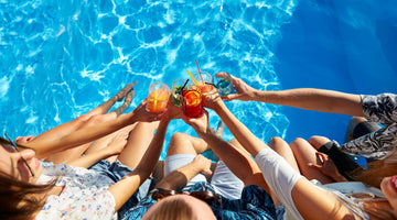 People toasting to a fun day at the pool