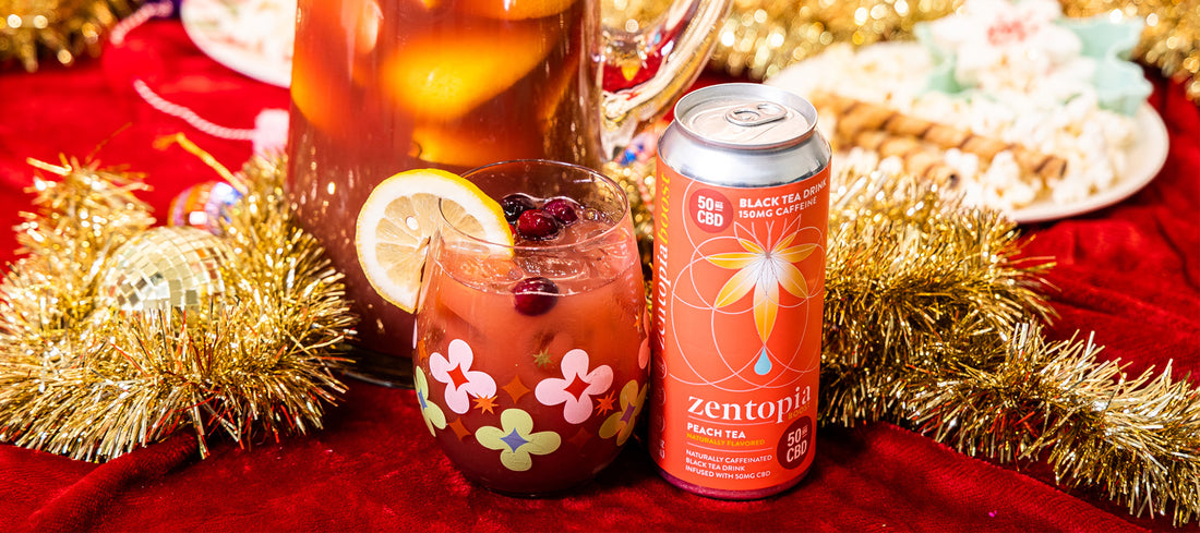 A can of Zentopia Peach CBD Tea and a glass Cranberry Spice CBD Sangria