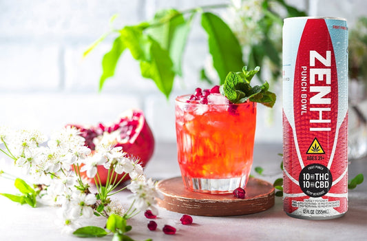 A can on Zentopia's ZenHi Punch Bowl THC + CBD-infused drink and a glass of Pomegranate Punch Mocktail