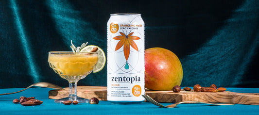 A can of Zentopia Mango CBD Chill Sparkling Water and a glass of a Mango Fall Mocktail