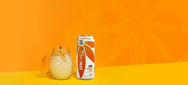 A can of Mango CBD Zentopia next to a refreshing mocktail